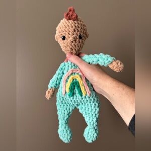 Handcrafted crochet rainbow baby doll